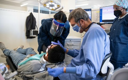 Ramsay Koury, DDS, supervises students at the Shady Grove Mission of Mercy.